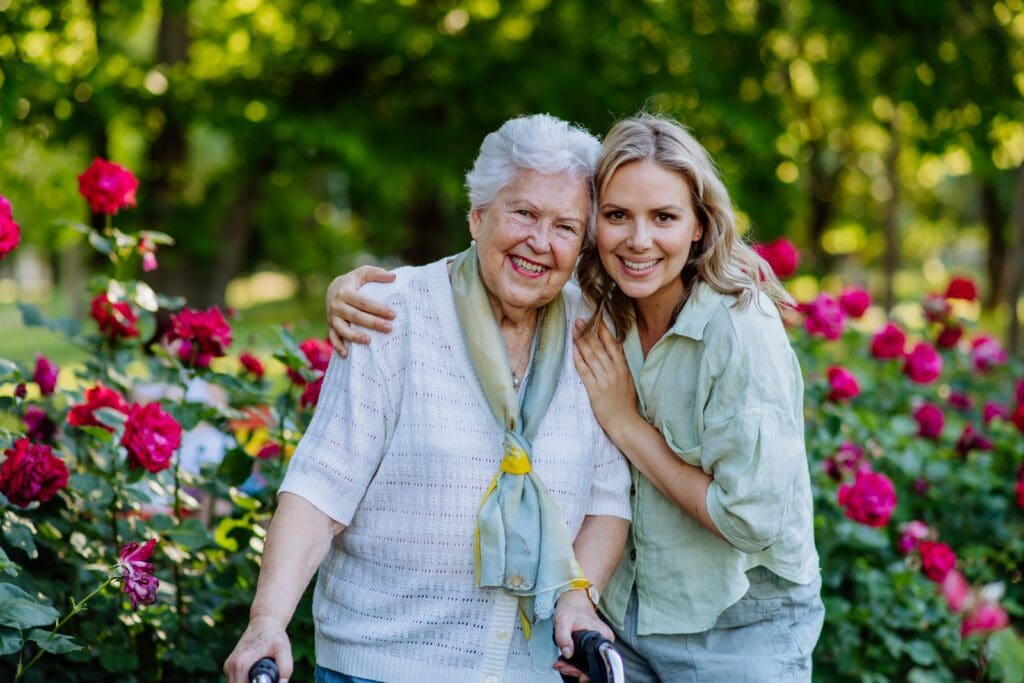 Happy senior woman with visiting adult daughter in a warm, welcoming Christian senior community in Houston